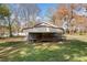 Angled view of exterior with gray siding and covered porch in green yard at 434 Mac Johnson Nw Rd, Cartersville, GA 30121