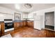 Kitchen features vintage white cabinetry, black appliances and a sink under the window at 434 Mac Johnson Nw Rd, Cartersville, GA 30121