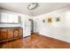 Kitchen featuring hardwood floors, white appliances, and wood cabinetry at 434 Mac Johnson Nw Rd, Cartersville, GA 30121