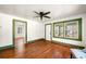 Sunlit living room with hardwood floors, neutral walls, and multiple windows at 434 Mac Johnson Nw Rd, Cartersville, GA 30121