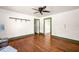 Living room features hardwood floors, open doorway, and neutral walls with white trim at 434 Mac Johnson Nw Rd, Cartersville, GA 30121