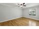 Bedroom with hardwood floors, neutral paint, and bright window at 4430 Tilly Mill Rd # 1304, Atlanta, GA 30360