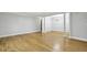 Open living space with hardwood floors leading to a dining area with chandelier at 4430 Tilly Mill Rd # 1304, Atlanta, GA 30360