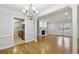 Open-concept living area with hardwood floors, fireplace, and entrance to the kitchen at 4430 Tilly Mill Rd # 1304, Atlanta, GA 30360