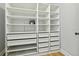 Bright walk-in closet with custom shelving, drawers and bonus safe for organizing your wardrobe and valuables at 4430 Tilly Mill Rd # 1304, Atlanta, GA 30360