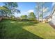 Large backyard with green lawn and wooden fence, ideal for relaxation and recreation at 294 Arnold Mill Rd, Woodstock, GA 30188