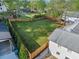 Expansive backyard features lush green grass, a wood fence, and mature trees for privacy at 294 Arnold Mill Rd, Woodstock, GA 30188