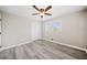 This bedroom is features modern gray walls, wood-look floors, and a closet at 294 Arnold Mill Rd, Woodstock, GA 30188