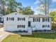 Charming painted brick split-level home with a manicured lawn, offering classic curb appeal at 294 Arnold Mill Rd, Woodstock, GA 30188