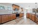 Well-appointed kitchen boasting wood cabinets, granite countertops, and stainless steel appliances at 294 Arnold Mill Rd, Woodstock, GA 30188
