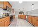 Spacious kitchen with granite countertops, stainless steel appliances, and an open layout to the living area at 294 Arnold Mill Rd, Woodstock, GA 30188