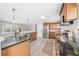 Modern kitchen with granite counters, stainless steel appliances, and an open layout at 294 Arnold Mill Rd, Woodstock, GA 30188