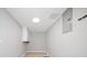 The laundry room has tile floors, overhead light, and overhead storage at 294 Arnold Mill Rd, Woodstock, GA 30188