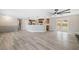 Open-concept living space features wood floors, modern lighting, and a clear view into the kitchen at 294 Arnold Mill Rd, Woodstock, GA 30188