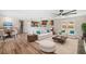 Inviting open-concept living area with stylish furnishings, hardwood floors, and a view of the kitchen at 294 Arnold Mill Rd, Woodstock, GA 30188