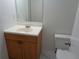Bathroom featuring a vanity with wooden cabinets, a sink, mirror and a toilet at 3091 Colonial Way # B4, Atlanta, GA 30341