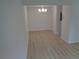 Modern dining room featuring new light fixture and wood laminate flooring at 3091 Colonial Way # B4, Atlanta, GA 30341
