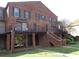 Charming brick townhouse with a balcony and well-maintained landscaping at 3091 Colonial Way # B4, Atlanta, GA 30341