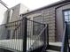 Back deck with black metal railings and access to side door and stairs at 3091 Colonial Way # B4, Atlanta, GA 30341