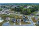 Neighborhood aerial view with lush trees and manicured lawns; featuring a pond and church nearby at 3169 Shadystone Way, Loganville, GA 30052