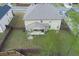 Aerial view of backyard featuring an expansive fenced yard, covered patio, and mature trees at 3169 Shadystone Way, Loganville, GA 30052