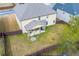 Aerial view of fenced backyard featuring a large yard and covered patio at 3169 Shadystone Way, Loganville, GA 30052