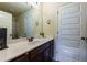This bathroom features a double door to the toilet area, along with a large mirror and storage cabinet at 3169 Shadystone Way, Loganville, GA 30052
