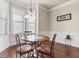 Bright breakfast nook with bay window, wood floors, and a round dining table at 3169 Shadystone Way, Loganville, GA 30052