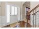 Bright foyer with hardwood floors and staircase, leading to a cozy living space at 3169 Shadystone Way, Loganville, GA 30052