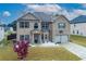 This stunning two-story brick home features beautiful landscaping and a two-car garage at 3169 Shadystone Way, Loganville, GA 30052