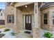 Inviting front porch with a well-maintained yard and a view of the house number at 3169 Shadystone Way, Loganville, GA 30052