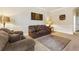 Cozy living room with comfortable seating and neutral decor for relaxation at 3169 Shadystone Way, Loganville, GA 30052