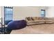 Comfortable living room with a large sofa, a cozy beanbag, and plenty of natural light at 3169 Shadystone Way, Loganville, GA 30052