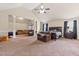 Large main bedroom featuring a vaulted ceiling, neutral color palette, and multiple seating areas at 3169 Shadystone Way, Loganville, GA 30052