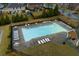 Aerial view of a sparkling community pool surrounded by lounge chairs and well-maintained landscaping at 3169 Shadystone Way, Loganville, GA 30052