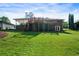 Beautifully landscaped backyard with a covered deck and a spacious lawn at 3925 Orchard Se Rd, Smyrna, GA 30080