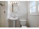 Clean bathroom featuring a pedestal sink and tiled shower at 3925 Orchard Se Rd, Smyrna, GA 30080