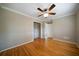 Bedroom featuring hardwood floors, a ceiling fan, and an open closet at 3925 Orchard Se Rd, Smyrna, GA 30080