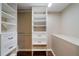 Custom closet featuring multiple storage shelves and drawers at 3925 Orchard Se Rd, Smyrna, GA 30080