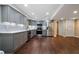 Modern kitchen boasts gray cabinets, stainless steel appliances, and pristine white countertops at 3925 Orchard Se Rd, Smyrna, GA 30080