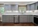 This kitchen features gray cabinets and stainless steel appliances at 3925 Orchard Se Rd, Smyrna, GA 30080