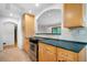 Kitchen includes wood cabinetry, stainless steel oven, and an open view to the living area at 3925 Orchard Se Rd, Smyrna, GA 30080