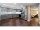 Modern kitchen boasts gray cabinets, stainless steel appliances, and pristine white countertops at 3925 Orchard Se Rd, Smyrna, GA 30080