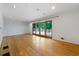 Spacious living room with hardwood floors and sliding doors to the outdoor deck at 3925 Orchard Se Rd, Smyrna, GA 30080