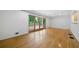 Bright living room with sliding doors to a deck and polished hardwood floors at 3925 Orchard Se Rd, Smyrna, GA 30080