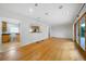 Open living room with hardwood floors and sliding doors leading to the deck at 3925 Orchard Se Rd, Smyrna, GA 30080