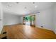Bright living room with hardwood floors and sliding doors to the deck at 3925 Orchard Se Rd, Smyrna, GA 30080
