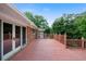 Wooden outdoor deck featuring decorative railing and doors to the home at 3925 Orchard Se Rd, Smyrna, GA 30080
