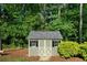 Charming backyard shed with a gray roof and black trim at 3925 Orchard Se Rd, Smyrna, GA 30080