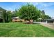 A well-maintained lawn and mature tree create a serene outdoor setting at 3925 Orchard Se Rd, Smyrna, GA 30080